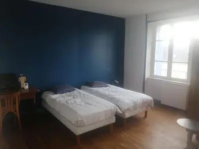 Un ou plusieurs lits dans un hébergement de l'établissement Grande maison dans un village côtier du Finistère