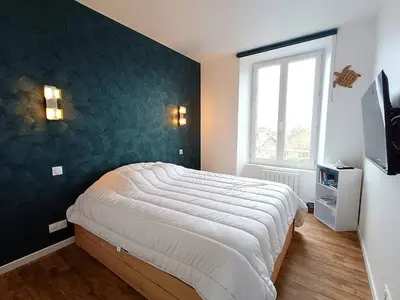Un ou plusieurs lits dans un hébergement de l'établissement Appartement au centre de TREBEURDEN et à 400m de la plage - Réf 662