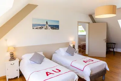 Un ou plusieurs lits dans un hébergement de l'établissement Villa KalonBreizh, Piscine privée chauffée & Sauna