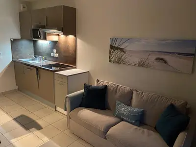 Cuisine ou kitchenette dans l'établissement Le Cabellou - Appt avec piscine commune