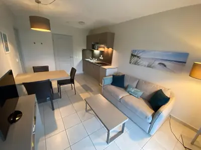 Coin salon dans l'établissement Le Cabellou - Appt avec piscine commune