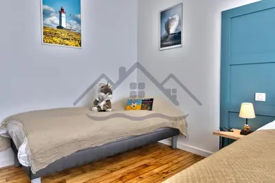 Un ou plusieurs lits dans un hébergement de l'établissement LocaLise - M1 - Bain de mer - Maison entièrement rénové avec jardin clos - Wifi inclus - Draps inclus - Animaux bienvenus