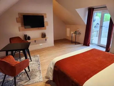 Télévision ou salle de divertissement dans l'établissement Ti Ar Kalon, maison proche de Quimper