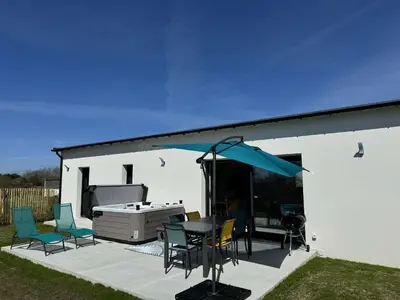 Coin salon dans l'établissement Maison bord de mer avec Jacuzzi