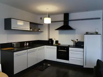 Cuisine ou kitchenette dans l'établissement Appartement au centre-ville Concarneau