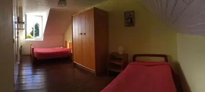 Un ou plusieurs lits dans un hébergement de l'établissement Maison bretonne traditionnelle en bord de Mer