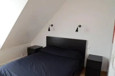 Un ou plusieurs lits dans un hébergement de l'établissement Maison dans son écrin de verdure