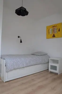 Un ou plusieurs lits dans un hébergement de l'établissement Maison dans son écrin de verdure