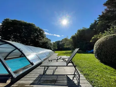 Jardin de l'établissement Le gîte Marie-Galante : Belle maison d'hôtes avec accès piscine en été