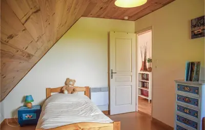 Un ou plusieurs lits dans un hébergement de l'établissement Nice Home In Plounéour-Trez With Sauna