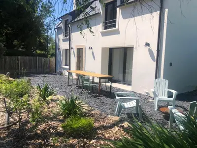 Jardin de l'établissement Maison de vacances - 3 chambres - proximité plage