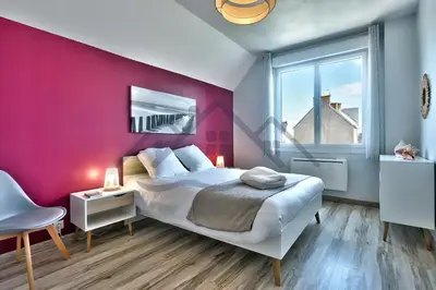 Un ou plusieurs lits dans un hébergement de l'établissement LocaLise - M2C - Ty Ma Bro -Maison avec extérieur entièrement clos - Wifi inclus - Draps inclus- Animaux bienvenus