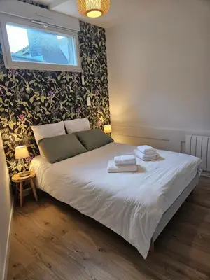 Un ou plusieurs lits dans un hébergement de l'établissement Le loft