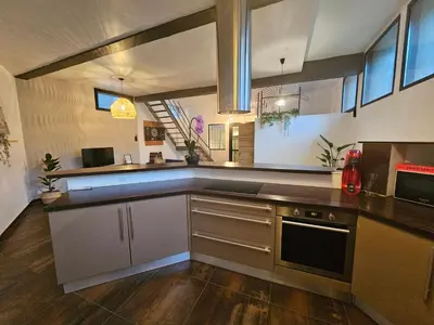 Cuisine ou kitchenette dans l'établissement Le loft