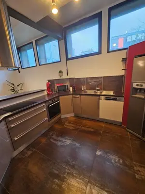 Cuisine ou kitchenette dans l'établissement Le loft