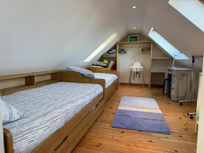 Un ou plusieurs lits dans un hébergement de l'établissement Maison de pêcheur idéalement située