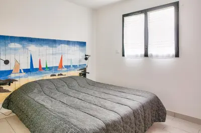 Un ou plusieurs lits dans un hébergement de l'établissement Maison pour 7 - jardin - accès pmr - 5min plage
