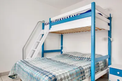 Un ou plusieurs lits dans un hébergement de l'établissement Maison pour 7 - jardin - accès pmr - 5min plage