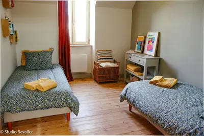 Un ou plusieurs lits dans un hébergement de l'établissement Gîte ty nina rosa