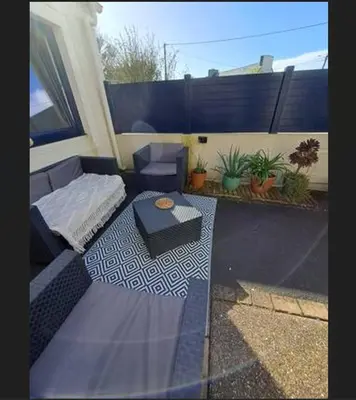 Coin salon dans l'établissement Maison de vacances à 500m de la mer