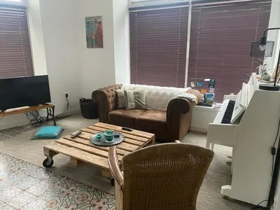 Télévision ou salle de divertissement dans l'établissement TY MAI - petite maison proche plages et commerces