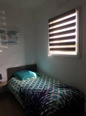 Un ou plusieurs lits dans un hébergement de l'établissement Maison cosy à 300m de la plage avec spa