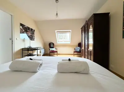 Un ou plusieurs lits dans un hébergement de l'établissement Maison de charme au calme