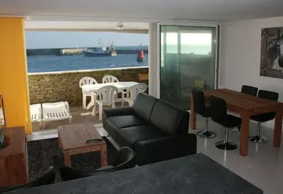 Coin salon dans l'établissement Le pieds dans l'eau - Direct sur la mer
