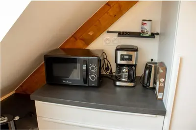 Cuisine ou kitchenette dans l'établissement Ar Bili/Vue mer/Wifi