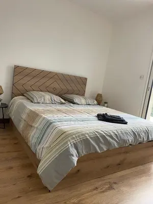 Un ou plusieurs lits dans un hébergement de l'établissement Villa Ty Loin vue mer 5 personnes