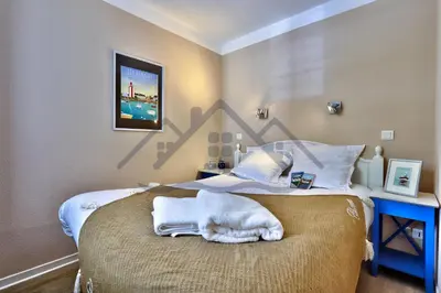 Un ou plusieurs lits dans un hébergement de l'établissement LocaLise - A18 - Appartement avec balcon - Petite vue mer à travers le palmier - Piscine de avril à septembre - Wifi inclus - Animaux admis - Draps inclus - Parking inclus