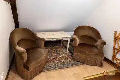 Coin salon dans l'établissement La maison du Cocher