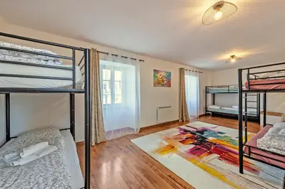 Un ou plusieurs lits dans un hébergement de l'établissement Maison Rioma - Grande maison à 200m de la plage