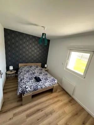 Un ou plusieurs lits dans un hébergement de l'établissement Maison Au Bout Du Pre