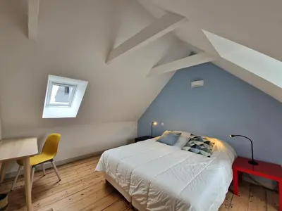Un ou plusieurs lits dans un hébergement de l'établissement House in Terenez with Stunning Harbour Views
