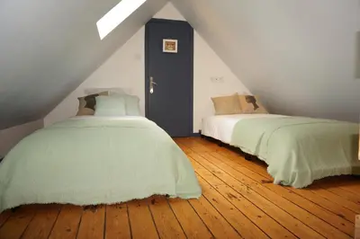 Un ou plusieurs lits dans un hébergement de l'établissement Ma petite maison bretonne