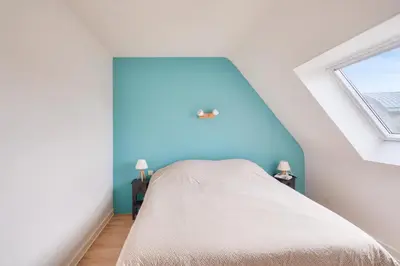 Un ou plusieurs lits dans un hébergement de l'établissement Piscine couverte - sauna - Maison pour 9 à Loctudy