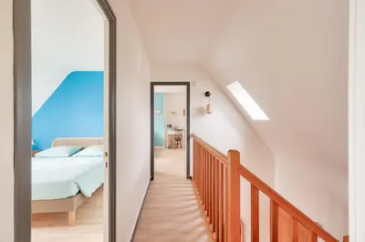 Un ou plusieurs lits dans un hébergement de l'établissement Piscine couverte - sauna - Maison pour 9 à Loctudy