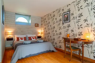 Un ou plusieurs lits dans un hébergement de l'établissement Le Relais - Maison avec grand jardin