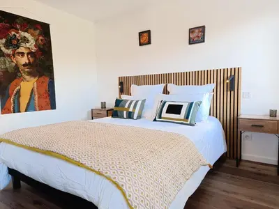 Un ou plusieurs lits dans un hébergement de l'établissement La chambre de KERLAGATU