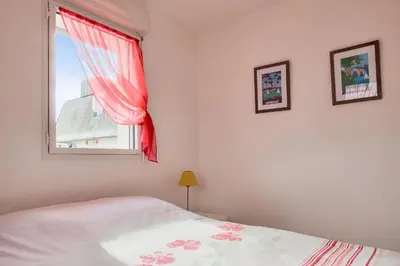 Un ou plusieurs lits dans un hébergement de l'établissement Proche plages et commerces, appartement pour 4