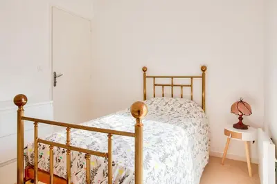 Un ou plusieurs lits dans un hébergement de l'établissement Proche plages et commerces, appartement pour 4