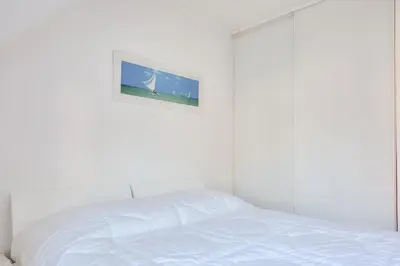 Un ou plusieurs lits dans un hébergement de l'établissement Proche plages et commerces, appartement pour 4