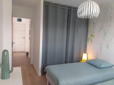 Un ou plusieurs lits dans un hébergement de l'établissement Le 101 - Plage du Dossen à Santec à 1.5 km