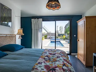 Un ou plusieurs lits dans un hébergement de l'établissement Holiday Home La Villa Agapanthes by Interhome