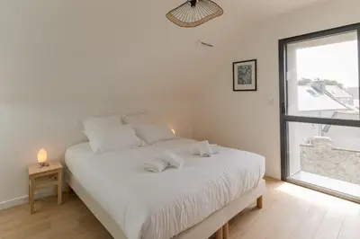 Un ou plusieurs lits dans un hébergement de l'établissement AR SKOL - Magnifique duplex face à la mer