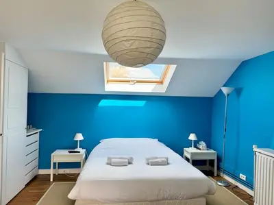 Un ou plusieurs lits dans un hébergement de l'établissement La Ferme, spacieuse maison tout confort, Bénodet
