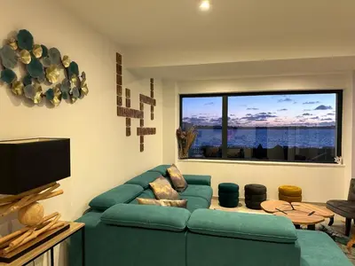 Télévision ou salle de divertissement dans l'établissement Villa les dunes