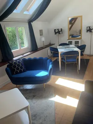 Coin salon dans l'établissement Maison cosy avec extérieur et piscine partagée