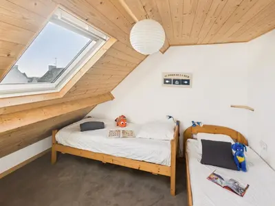 Un ou plusieurs lits dans un hébergement de l'établissement À 200m de la plage de Langoz - Maison pour 10